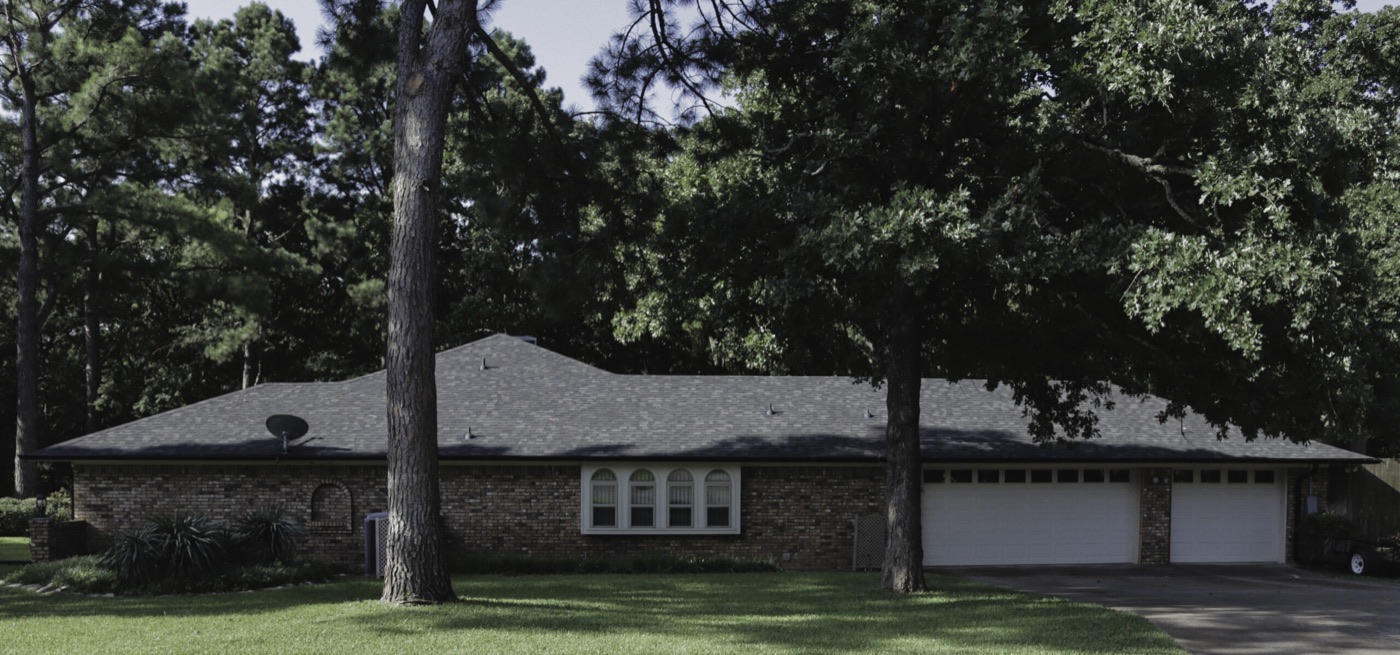 Completed composition shingle roof on a brick home