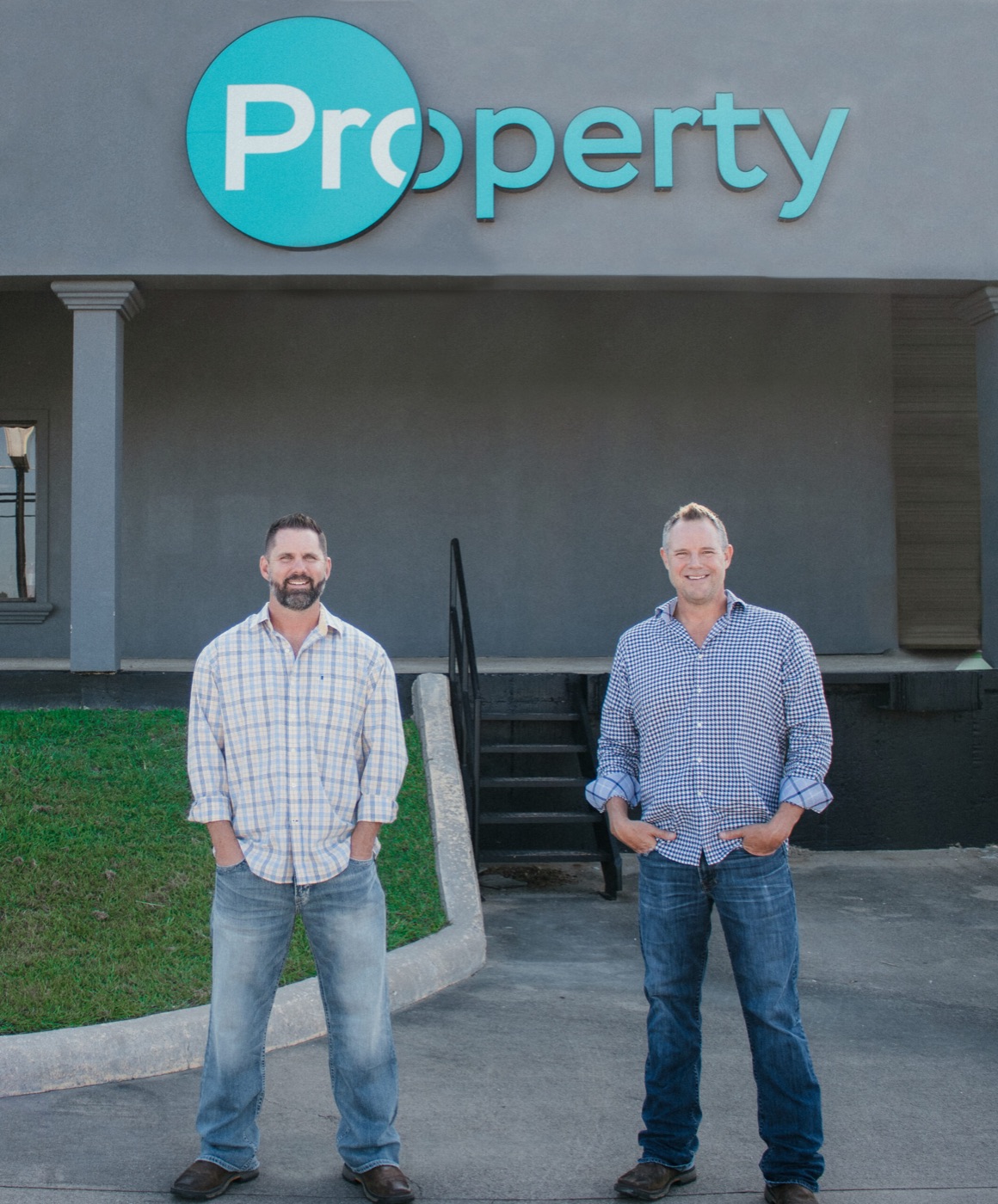 Owners Bub Moore and Cody Mitchell in front of the Property Builds office in Sherman, TX